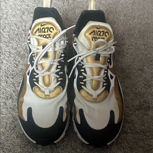 Nike Air Zoom Sneakers in Black, White, and Gold